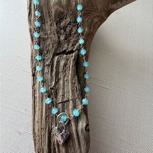 Elegant Silver Necklace with Blue Agate Beads and Artisan Heart Pendant